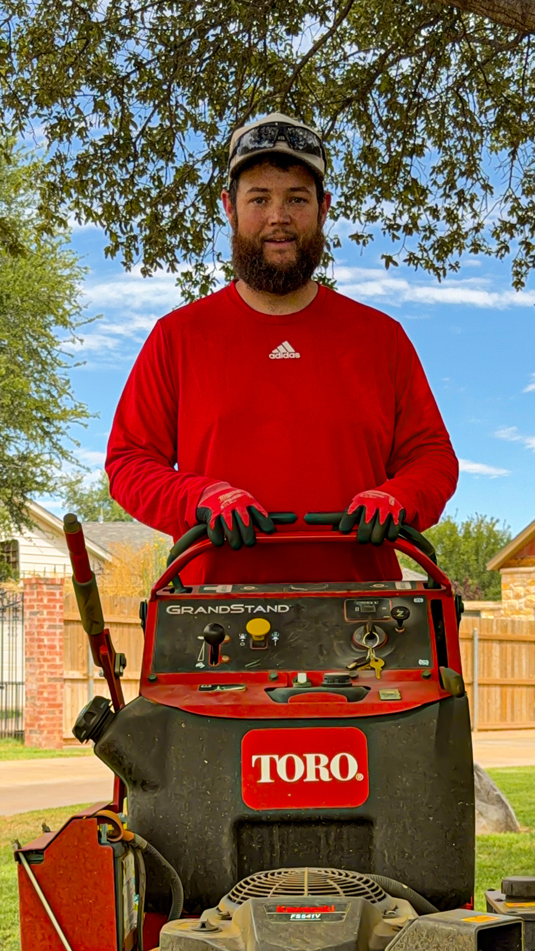 Derek mowing a yard during a rescue in West Texas
